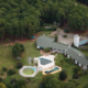 alt="Imagen aérea de las instalaciones y piscinas deterioradas en el marco de la licitación del Hotel Ayuí en Concordia"